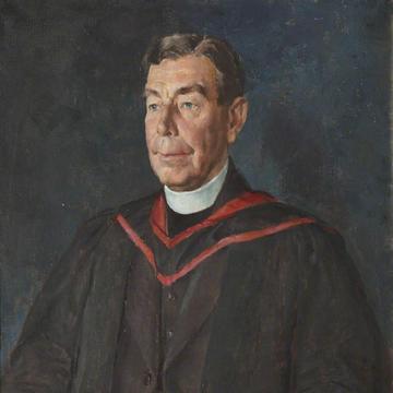 A three quarters length portrait of a man in academic dress with a dog collar